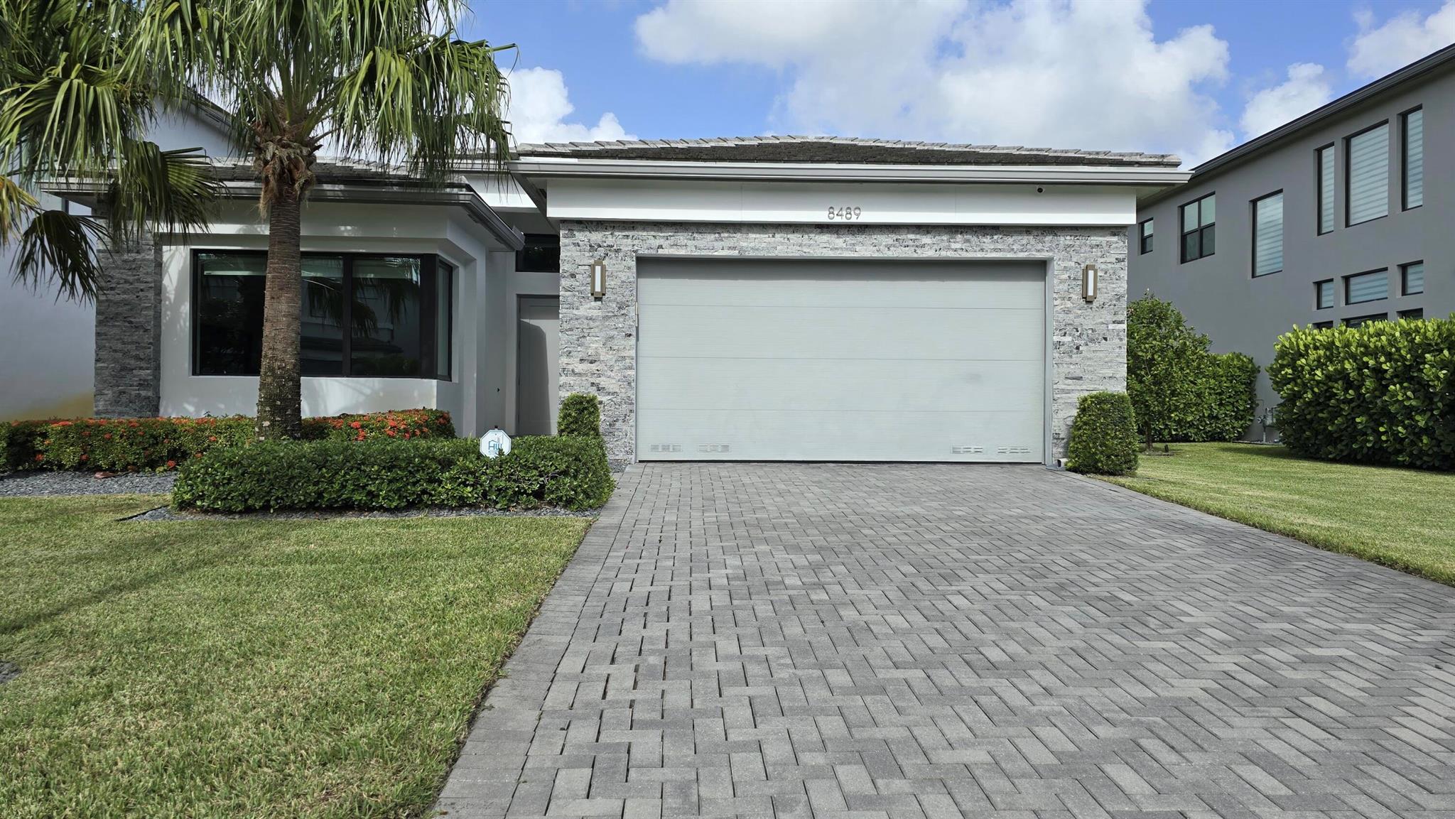 Newer construction and in immaculate condition, this stunning 3-bedroom home with a DEN/office (optional 4th bedroom) in the gated Lotus community is available for annual lease. Built in 2020, it offers a modern open layout, high ceilings, a gourmet kitchen with natural gas and double oven, and elegant finishes. Enjoy resort-style amenities: clubhouse, fitness center, indoor/outdoor basketball courts, Aqua Bistro & Bar, adult and kids' pools, splash pad, playground, pickleball, and tennis courts. Minutes to Delray Marketplace, Mizner Park, and Boca Town Center. Near Morikami Gardens and Boca Resort. Approx. 10 mi to Fort Lauderdale Airport and 15 mi to Palm Beach International, with Boca Executive Airport nearby. Zoned for top-rated schools. Move-in ready!