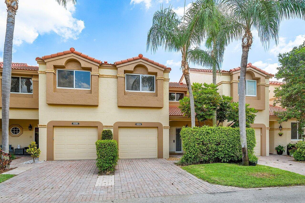 Welcome to this stunning 2-bed, 2.5-bath townhome in Cortina at Boca Pointe. This beautifully updated residence offers style & comfort, featuring a kitchen with 42'' wood cabinetry, granite countertops, & stainless steel appliances. The first level includes a half bath & tile flooring, while the upstairs boasts hardwood laminate & laundry for convenience. The primary bathroom features dual sinks & a glass-enclosed shower. A versatile bonus room offers endless possibilities as a playroom, office, or expansive primary closet. This home has a 1 car garage & is located in a manned gated community near top shopping & dining options. Zoned for excellent Boca Raton schools. Optional Boca Pointe Country Club membership is available. Investor-friendly, can rent right away. Schedule a tour today!