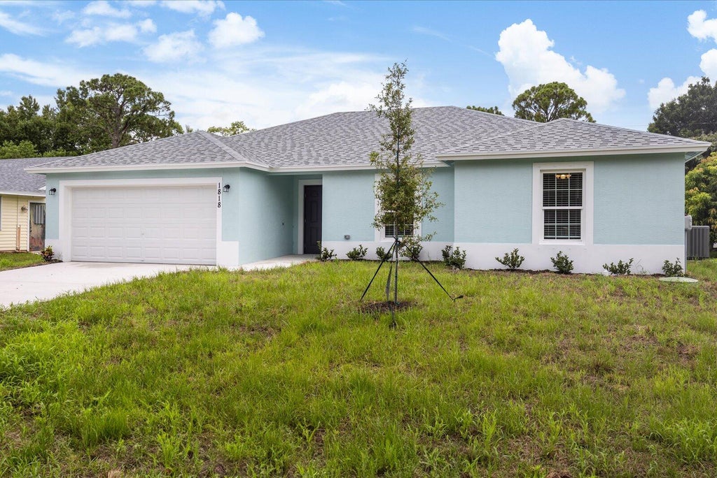 Photo of 1818 SW Bellevue Avenue, Port Saint Lucie, FL 34953 (MLS # R10983335)