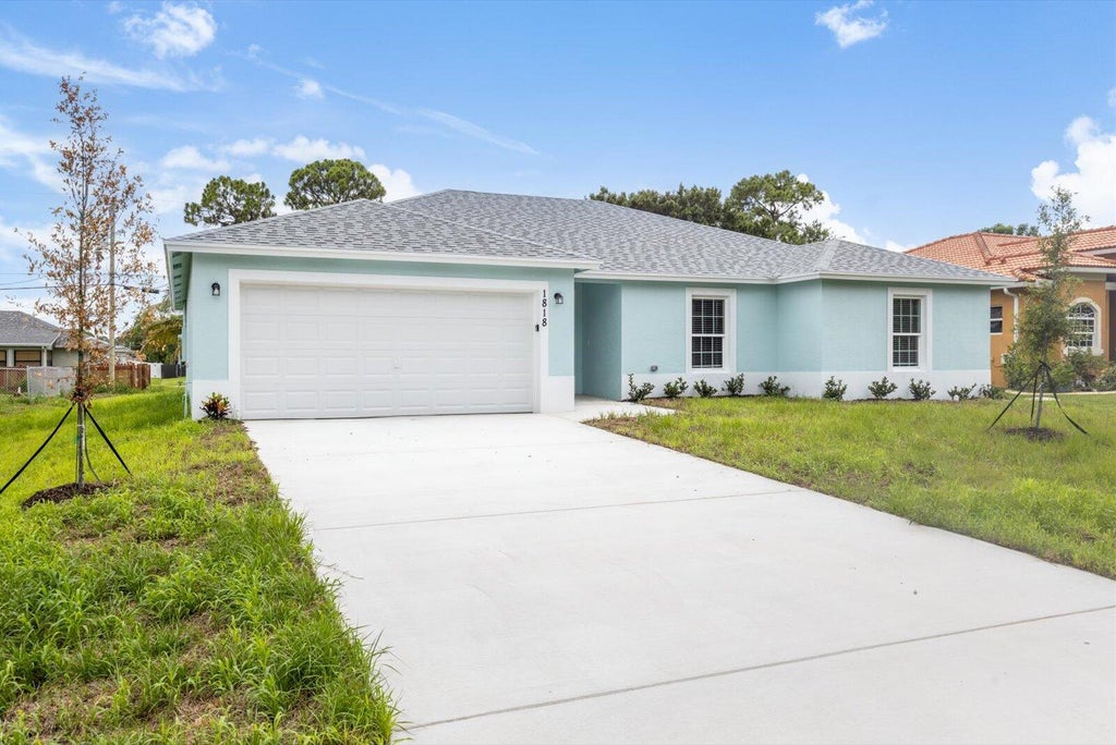 Photo of 1818 SW Bellevue Avenue, Port Saint Lucie, FL 34953 (MLS # R10983335)
