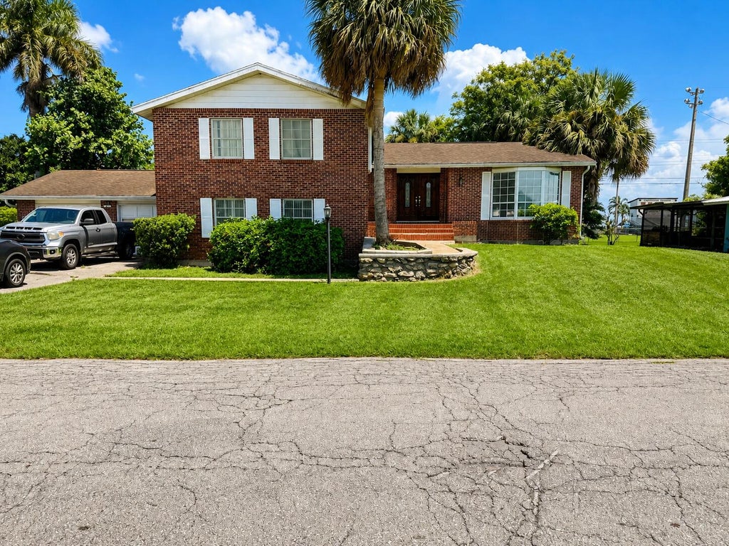 Photo of 909 NE 3rd Street, Belle Glade, FL 33430 (MLS # B26068029)