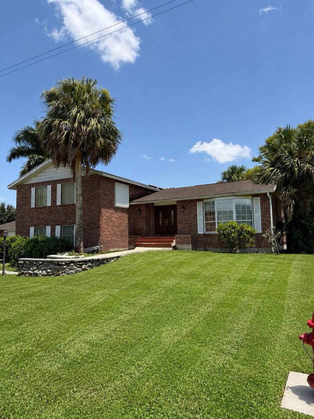 Photo of 909 NE 3rd Street, Belle Glade, FL 33430 (MLS # B26068029)