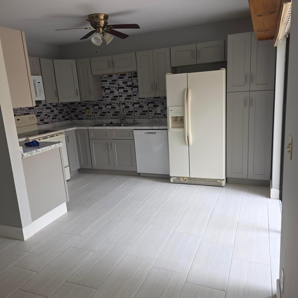 Photo of 1839 N CONGRESS Avenue W #1839, West Palm Beach, FL 33401 (MLS # B26062653)