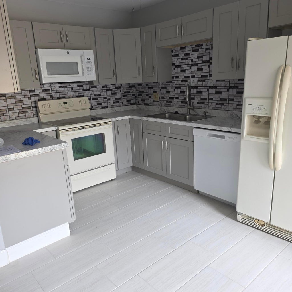 Photo of 1839 N CONGRESS Avenue W #1839, West Palm Beach, FL 33401 (MLS # B26062653)
