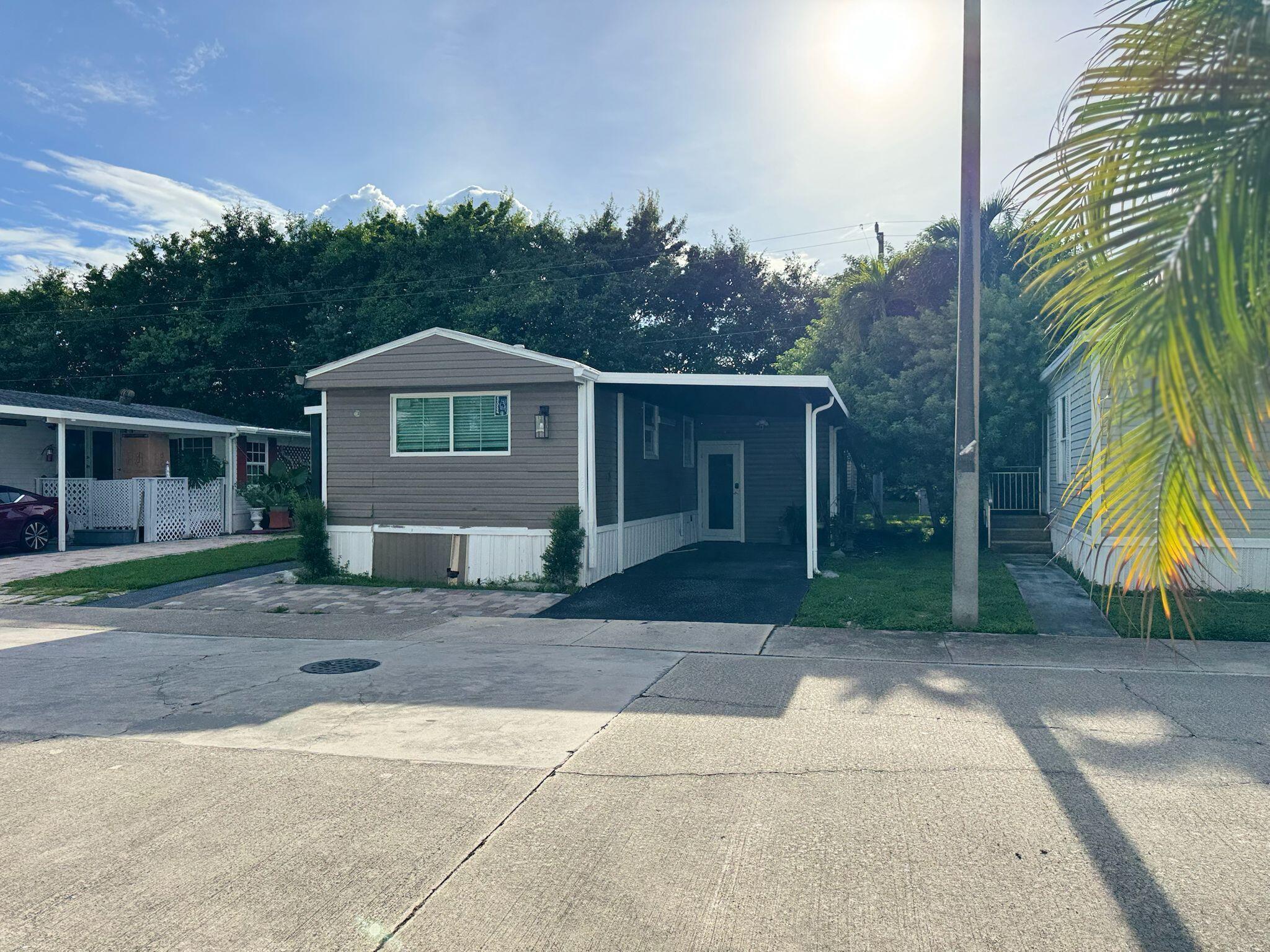 Just Listed - Newly Renovated & Move-In Ready! Beautifully updated 3 Bed / 2 Bath mobile home in one of the best locations in the park. Features a bright, spacious kitchen, open layout, cozy outdoor deck, and parking for two or more vehicles. Located in a well-maintained all-ages community with A-rated schools and top amenities: Pool | Gym | Court | Clubhouse | Playground.Lake Worth, FL - close to shops, dining, public transport & the beach.All measurements are approximate. Call the listing agent today to schedule your showing! Don't miss the chance to live comfortably with the best lake view in the community!