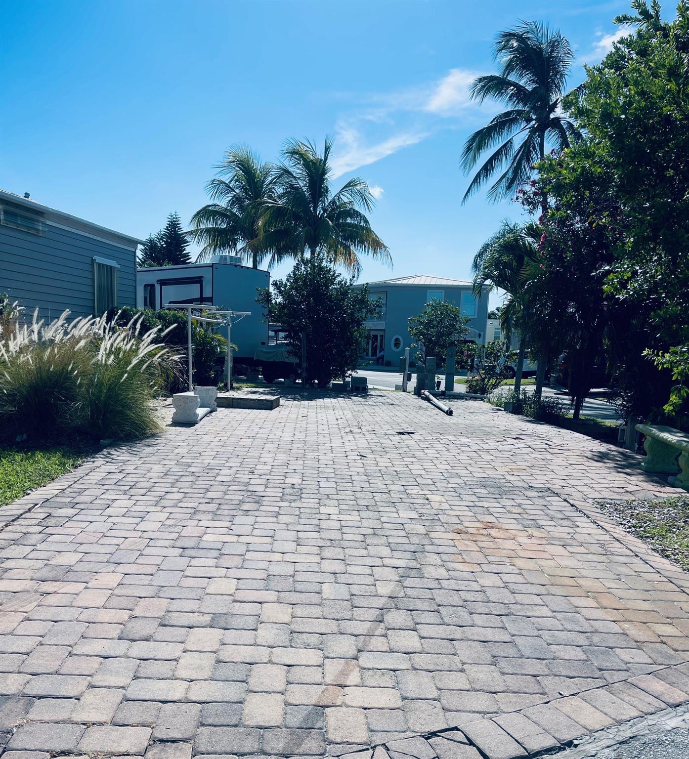RV Lot located steps from the Recreation Center which features one of the community pools, tennis courts, pickle ball courts, shuffle board, bocce, horseshoes and more. The ocean pool and private beach access are just a short stroll or golf cart ride away. Nettles is a guard gated community located on Hutchinson Island between the Atlantic Ocean and the Intracoastal Waterway. This lot is ready for your RV or you could build your dream beach cottage. Come see why we love our beach lifestyle here on Nettles Island.