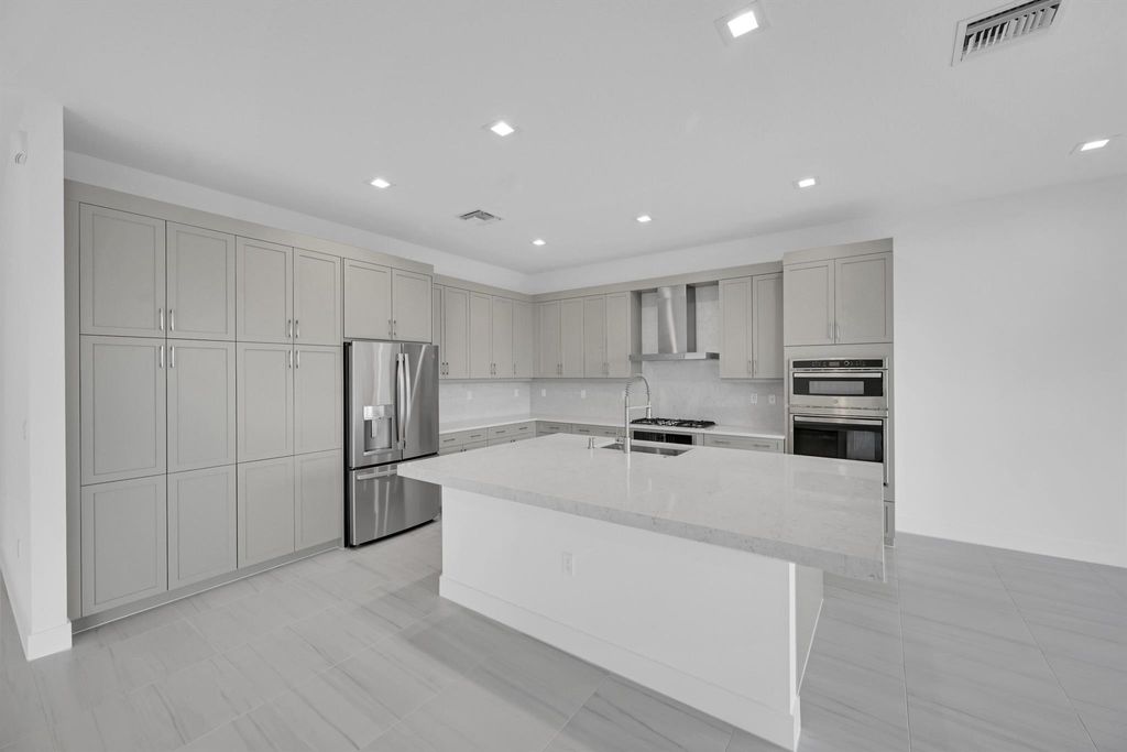 Photo of 10040 Stockrun Drive, Palm Beach Gardens, FL 33412 (MLS # R11105459)