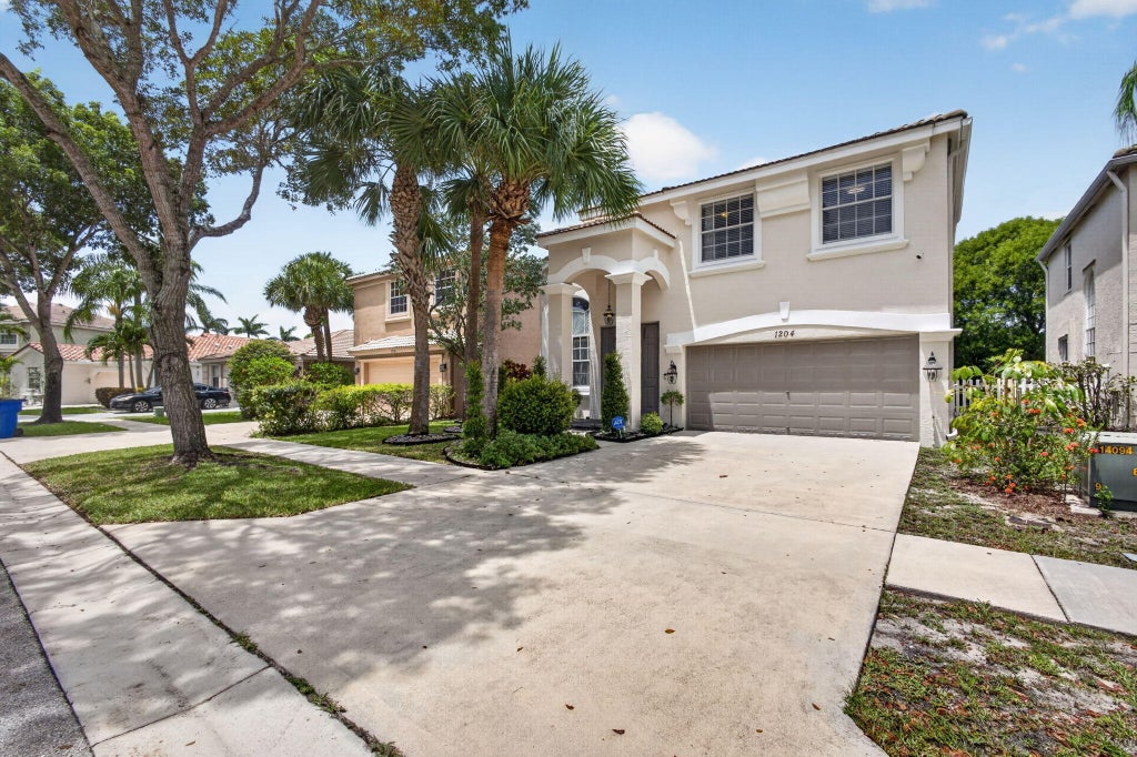 Photo of 1204 OAKWATER Drive, Royal Palm Beach, FL 33411 (MLS # B26062245)