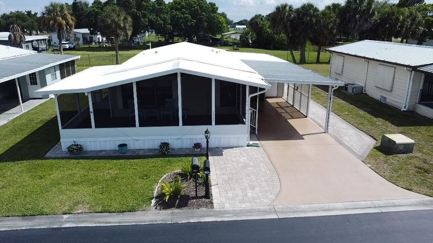 Enjoy the Florida lifestyle in this charming 2BR/2BA home nestled in a vibrant 55+ community! Start your mornings on the oversized screened front porch and entertain guests in a beautifully updated kitchen featuring granite countertops and a functional island. This active community offers a pool, clubhouse, and shuffleboard, along with social events and activities year-round. A perfect blend of comfort, convenience, and community living. Move-in ready and a must-see!