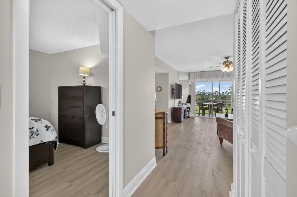 Photo of 3871 Via Poinciana #407, Lake Worth, FL 33467 (MLS # B26080868)