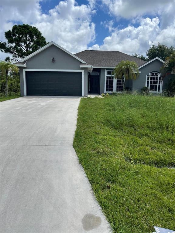 Photo of 2619 SW Fair Isle Road, Port Saint Lucie, FL 34987 (MLS # R10727929)