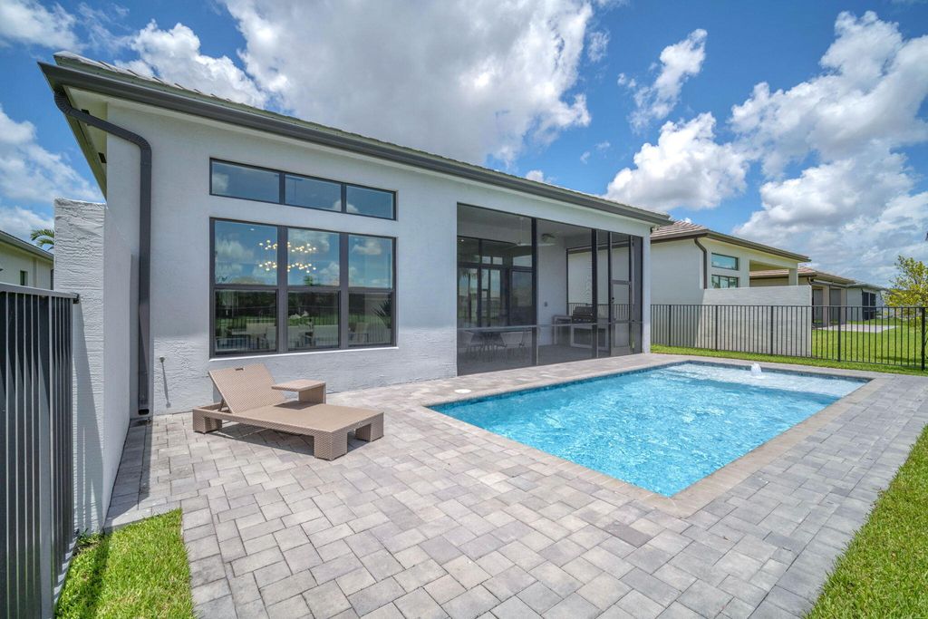 Photo of 9651 Spruce Woods Drive, Boynton Beach, FL 33473 (MLS # B26033111)