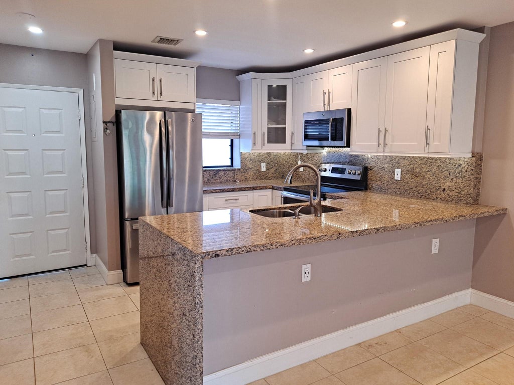 Photo of 11441 NW 39 Court #320-3, Coral Springs, FL 33065 (MLS # B26080383)