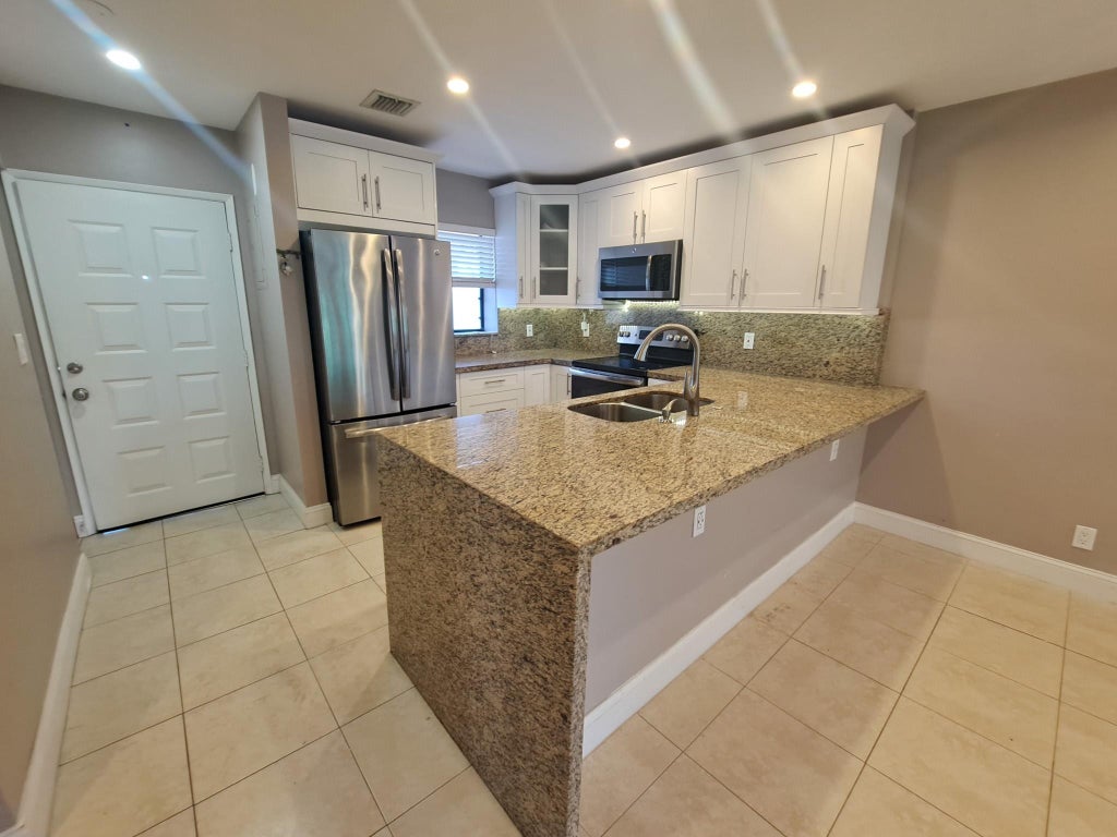 Photo of 11441 NW 39 Court #320-3, Coral Springs, FL 33065 (MLS # B26080383)