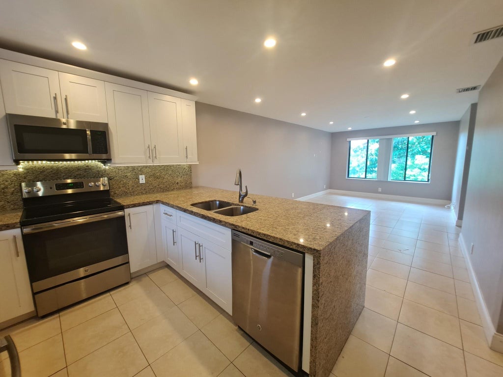 Photo of 11441 NW 39 Court #320-3, Coral Springs, FL 33065 (MLS # B26080383)