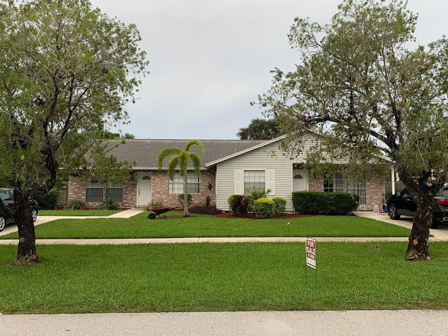 BEAUTIFUL DUPLEX WITH CERAMIC TILE THROUGHOUT, REMODEL, ENCLOSED SCREEN PATIO, LARGE YARD NEW AC ON BOTH UNITS PRIME LOCATION RATED A SCHOOLS, BEAUTIFUL NEIGHBORHOOD,LIVE IN ONE RENT THE OTHER AND MAKE RENTAL INCOME NO HOA - SCREEN FLORIDA ROOM.