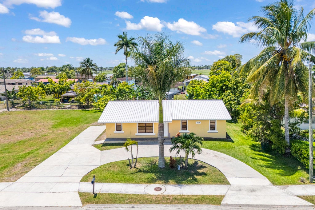 Photo of 1332 SW G, Belle Glade, FL 33430 (MLS # R11093559)