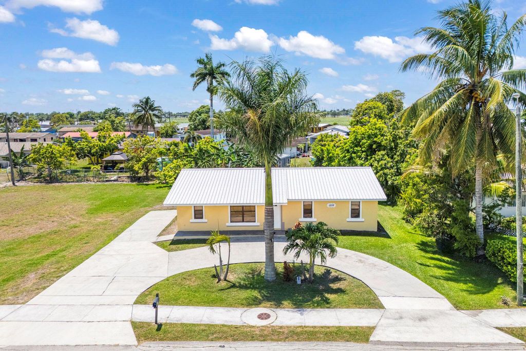 Photo of 1332 SW G, Belle Glade, FL 33430 (MLS # R11093559)