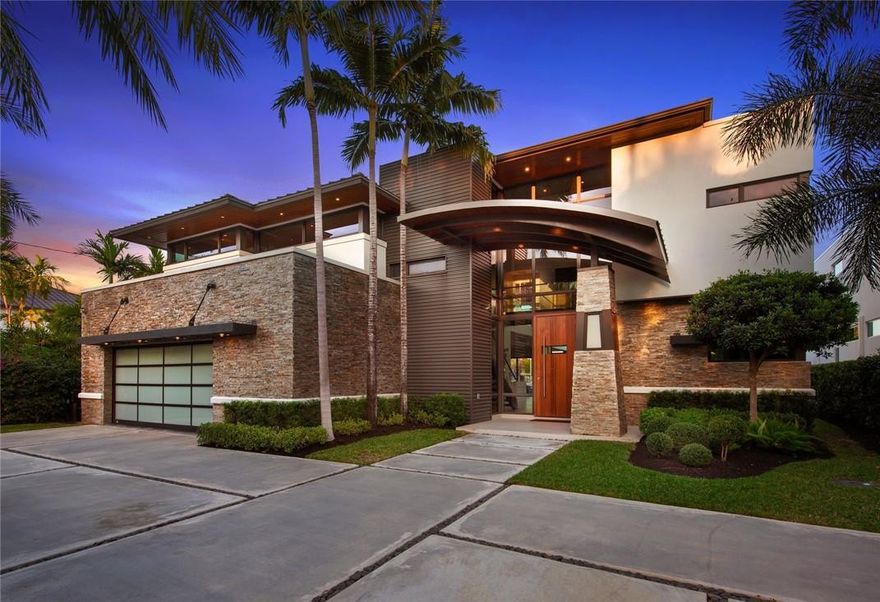 The Hottest House on the Block! Recently built Tropical Modern Waterfront home with stunning architecture and curb appeal. Nestled on a quiet street, yet only steps away from Las Olas!  This 6 BR / 5.5 BA, has over 6k sq ft of total space flooded with natural light. Perfect for entertaining family and friends with impeccably curated interiors, Italian porcelain and real hardwood compliment effortlessly, a glass sky bridge floats amid 25' ceilings. Chefs kitchen with Wolf, SubZero, quartz countertops with waterfall edging and custom cabinetry. One-of-a-kind master suite with a closet to die for, pocketed glass walls provide seamless indoor/outdoor living, huge loggia with summer kitchen and a Real backyard! Relax in the heated, saltwater, LED-lit pool and spa...but hurry, Priced to Sell!