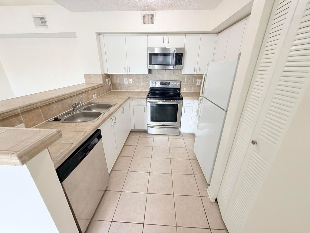 Photo of 1749 Village Boulevard #304, West Palm Beach, FL 33409 (MLS # B26011822)