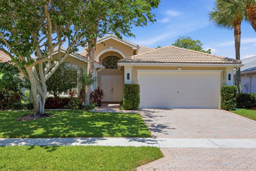 Priced to sell! Sought after South Pacific model situated on an interior lake lot!  Freshly painted a neutral color throughout, this true 3 bedroom (den/office features a closet)/2 bath home features tile on the diagonal throughout the main living area and NEW carpets in the bedrooms. LED recessed lighting.  Split floor plan. Large size primary with water views, walk-in closet and his/her sinks w/ separate shower and tub. Screened lanai faces North making it perfect to enjoy evenings relaxing or entertaining guests.  Accordion shutters.  Walking distance to the satellite pool/fitness center.  Valencia Isles renovated clubhouse features a Bistro and amenities to keep you busy all week long.  4 Additional pickleball courts and 2 bocce courts coming fall 2026!  A must see!