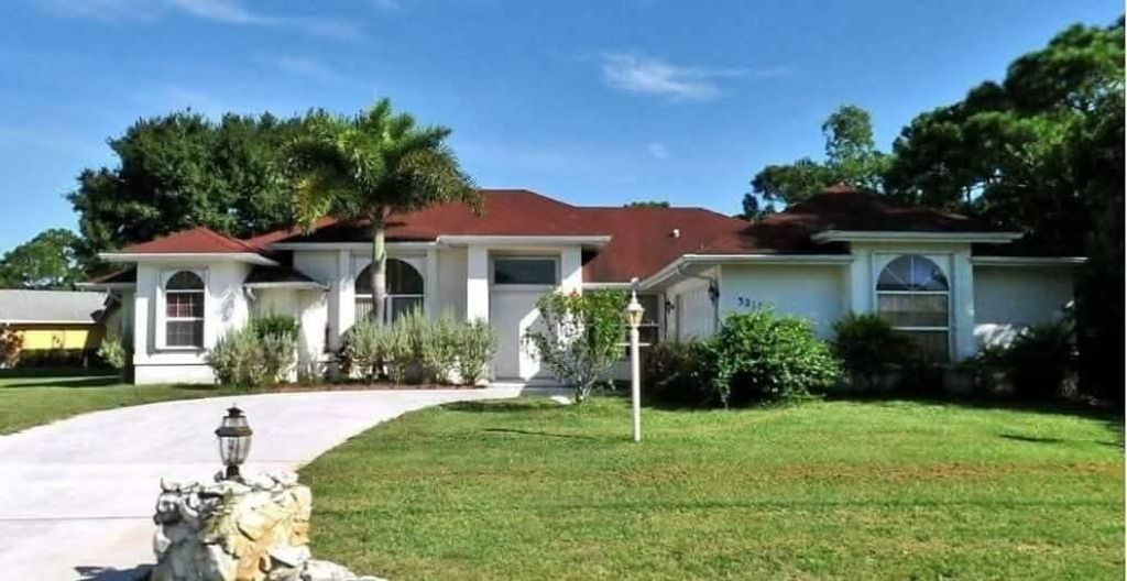 Photo of 3217 SE Quay Street, Port Saint Lucie, FL 34984 (MLS # B26035930)