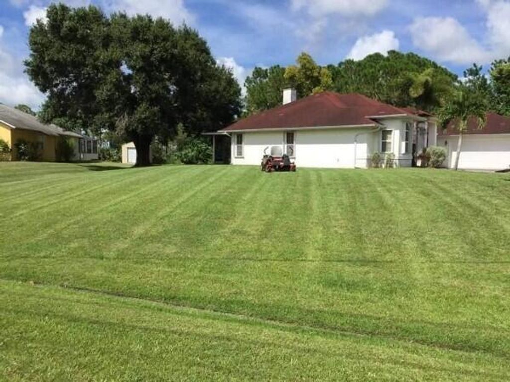 Photo of 3217 SE Quay Street, Port Saint Lucie, FL 34984 (MLS # B26035930)