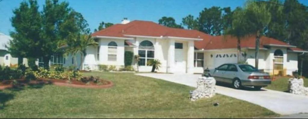 Photo of 3217 SE Quay Street, Port Saint Lucie, FL 34984 (MLS # B26035930)
