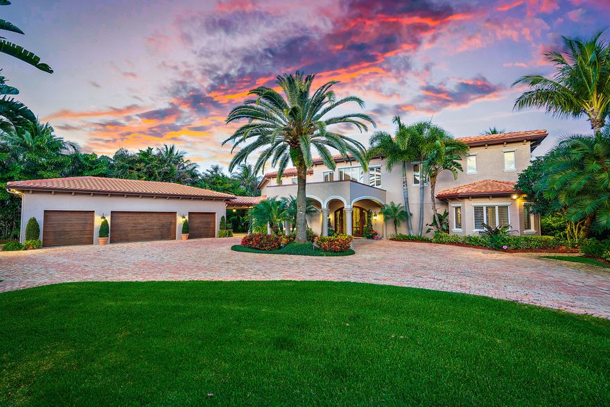 Where the Loxahatchee River meets the North Fork you will find a protected cove with blue water.  This 1.4 acre gated estate has an eastern exposure. Chicago Brick paver driveway, lush tropical landscaping abounds to the Porte-cochere and motor court. Two story home, with 4 car garage overlooking the beautiful Loxahatchee River. Enjoy blue water on incoming tides year round. Handcrafted entry doors lead to an elegant entry foyer with a coastal flair.  Custom traditional wood work includes wood ceilings, custom moldings and walls. Two way gas fireplace in the main living room to the study. Private dining room can accommodate 10 or more. First floor master or an elevator across a bridge to a grand master suite with breakfast bar, sitting room, private balcony, his and her private baths and walk-in closets, and a private laundry room. Two guest bedroom suites with a private patio.  The family great room combined with the kitchen, breakfast bar, eating area, wet bar, wine cooler. Kitchen features, spacious breakfast bar for up to 6 people, sub-zero fridge and freezer, Viking stove, 4 burner s  and griddle, double ovens, warming drawer, and custom built-in pantry   Two propane gas tanks for the whole house generator, pool /spa and outside barbeque. Outside covered patios are ideal for outside living. Guest house has kitchen, living-room, full bath, laundry, and two car garage. Two Boat docks three lifts include; one 30,000lb lift, and two 10,000 lb lifts. Seawall was replaced in 2009, main house roof replaced in 2019. Clay tennis courts resurfaced March 2020,