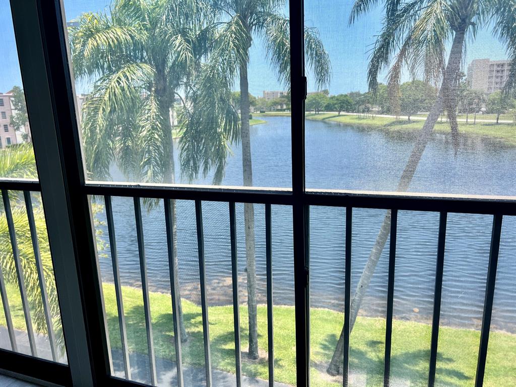 Beautifully updated spacious 2 bedroom & 2 bath condo with spectacular lake views! Newly renovated with brand new flooring, all new appliances and built in shelves and closets. You'll experience tranquility and comfort in this immaculate and freshly painted move in ready unit! The condo features 2 large bedrooms with walk in closets, a kitchen with eat in area, living room, dining room, fully screened patio, laundry room and plenty of storage. The master bedroom offers two walk in closets plus a bonus sitting area with direct access to the patio. You'll enjoy serene long views of the lake from almost everywhere in the condo along with lots of natural night.