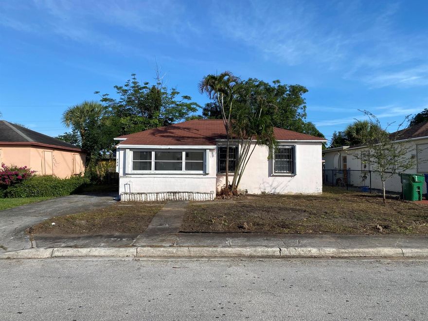 *Huge potential for a profitable flip or cash cow rental* Ready for a renovation or to add your personal touches. 4 bedrooms, 1 bath, large screened patio, central HVAC system, and attached laundry room in the heart of Riviera Beach near the marina. 4 bedroom rentals in this area rent upwards of $3200 and sell for $350k+. Submit your offers today. Laundry room and Central HVAC