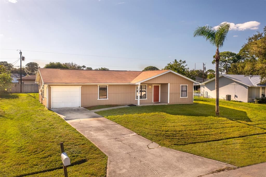 Photo of 1034 SE Proctor Lane, Port St Lucie, FL 34983 (MLS # R10837353)