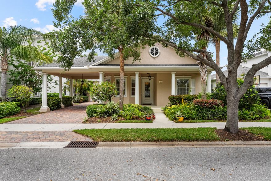 Rare opportunity in Abacoa! This desirable single-story floor plan offers 3 bedrooms plus a bright den with a beautiful bay window, all within an open, light-filled layout designed for effortless living. The spacious primary suite features an expansive closet and doors that open directly to the private backyard—where you'll enjoy the rare benefit of no home behind you.Two guest bedrooms are thoughtfully designed with a separate pocket door, creating an ideal private guest suite. Additional highlights include mature landscaping, a welcoming front porch, paver driveway with porte cochère, and a convenient side entrance. Located in Martinique at Abacoa, residents enjoy access to a community pool, clubhouse, fitness center, and playground.  Just minutes from Abacoa Town Center, where you'll find dining, shopping, live events, and spring training baseball. Close to top-rated schools, major highways, and everything Jupiter has to offer.