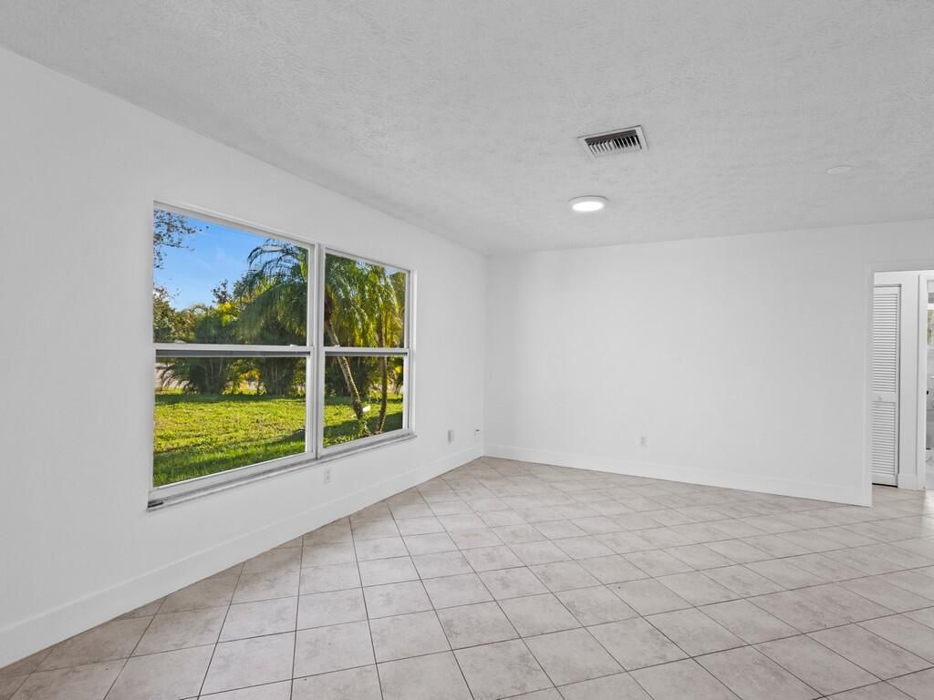 Photo of 2432 SW Loquat Road, Port Saint Lucie, FL 34953 (MLS # R11057497)