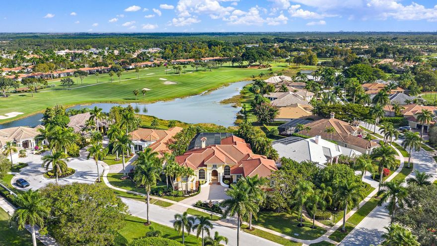 Perfectly positioned on a half-acre lot just moments from the main gate and premier amenities of The Club at Ibis, this stunning custom estate offers timeless architecture, thoughtful design, and sweeping long water and golf course views overlooking the fairway of the Nicklaus-designed Legend Course #6. Adding immediate peace of mind, the roof was replaced in 2022, complementing the home's exceptional scale and enduring quality. Encompassing 5,915 square feet under air and 7,565 total square feet, the residence features four bedrooms, four full baths, three half baths, a private office, a theater/game room, and a 3.5-car garage. Designed for effortless living, all primary spaces--including the owner's suite, three spacious guest suites, and den--