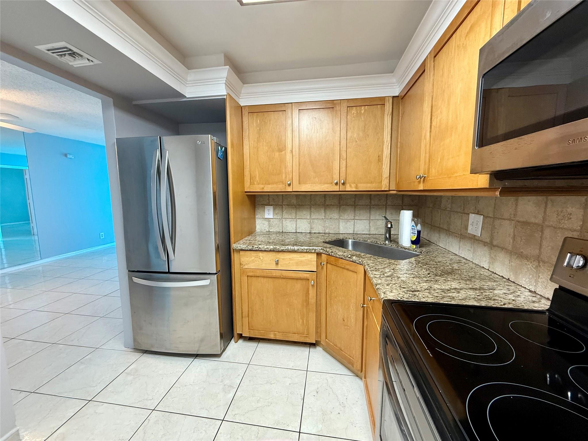 Live on the beach for less than $2,000/month! Enjoy this 1 bedroom 1 bath condo, tiled throughout, updated eat-in kitchen with stainless appliances, no dishwasher, walk-in closet in bedroom, impact window and door. Cable and internet included, garage parking, fabulous recreation center on the beach with 2 pools, 2 gyms. bar, bbq grills and picnic tables on the beach and so much more. Walk to shopping, dining, fishing pier, tiki bar and all that Pompano Beach has to offer. Concrete restoration ongoing, balcony may be closed off at beginning of lease term.
