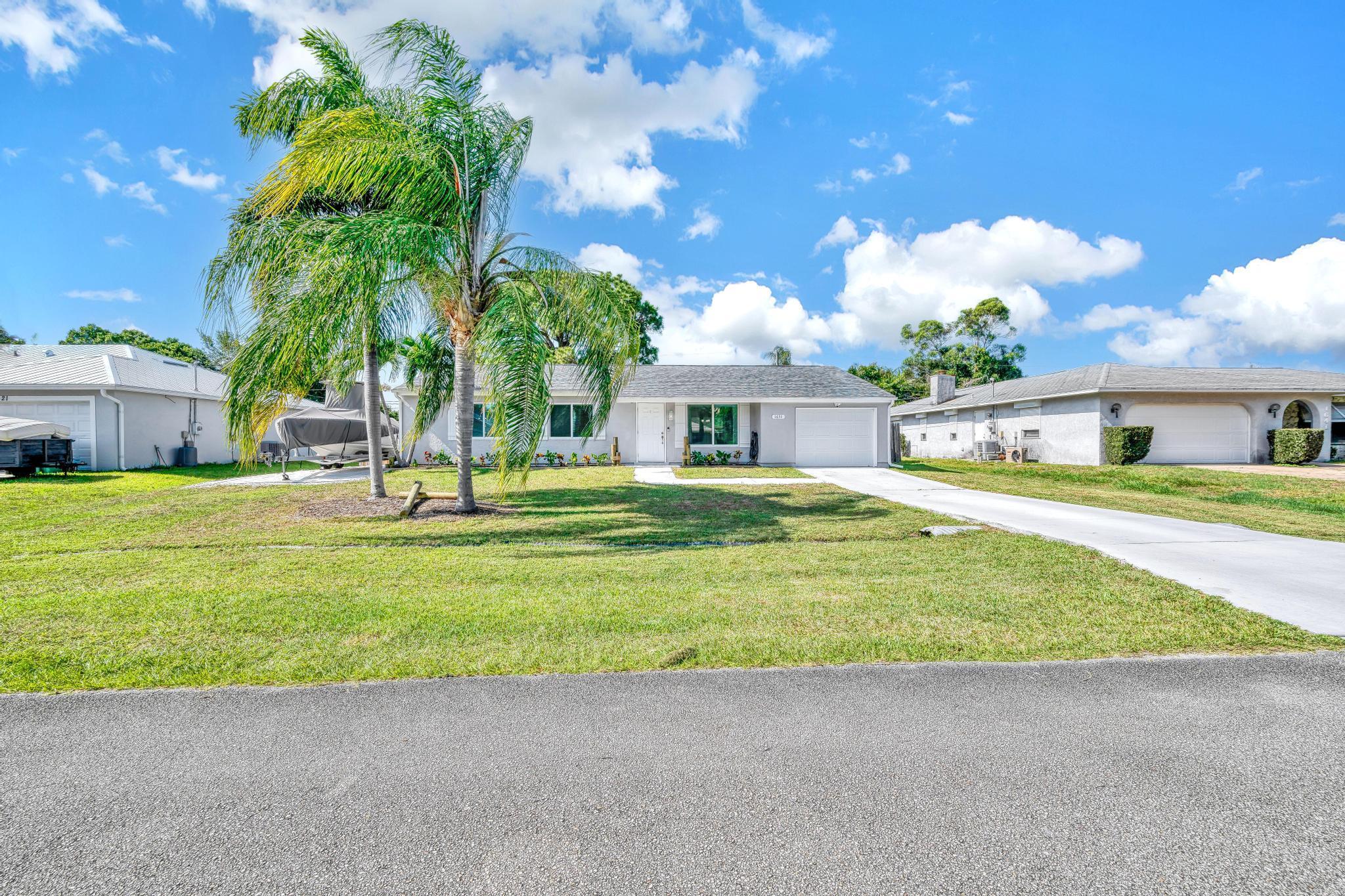 Come take a look at this meticulous rental located near Sandpiper Bay! Brand NEW IMPACT WINDOWS & DOORS throughout the entire home. There is a boat pad on the side of the house to park your boat at! There is also a new roof, newer A/C, newer water heater and newer appliances! Granite countertops in the kitchen and both bathrooms with beautiful oversized tile throughout. This house is on .23 acres with fenced in lot. Bring your fur babies! Meticulous landscaping in the front yard and brand new clusia trees were just planted in the backyard that will grow tall for lots of privacy. It is only a 15 minute drive to the beach, 12 minutes to downtown Stuart and less then 5 minutes to your local grocery store. This home will be leased unfurnished.