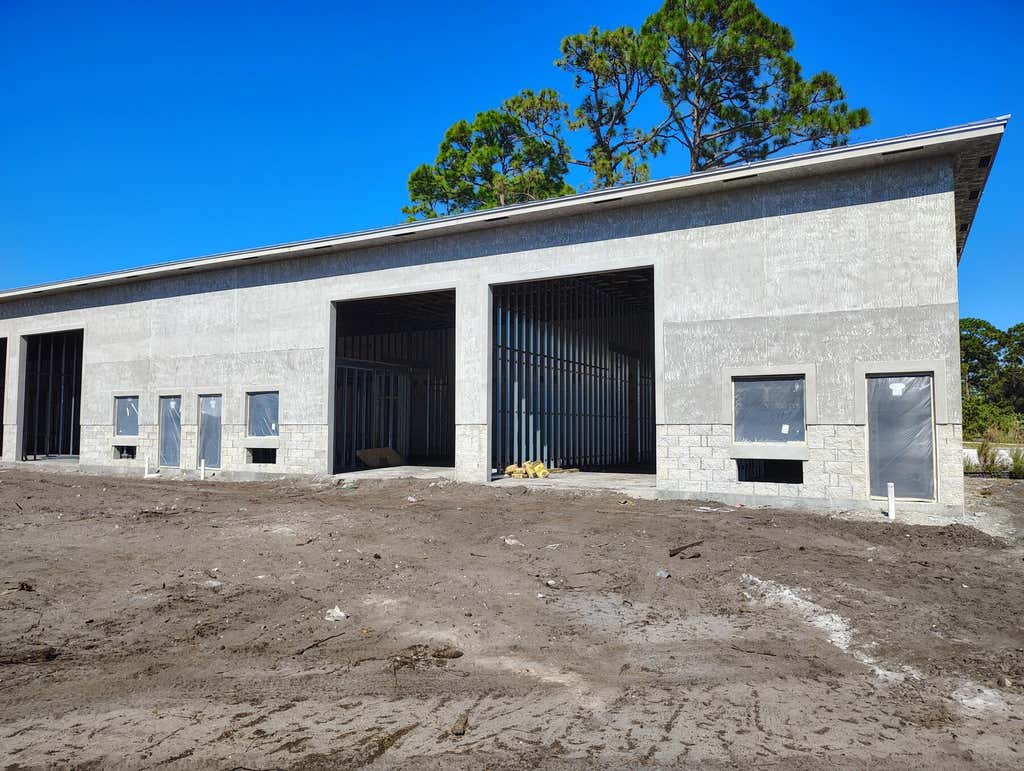 Photo of 2095 COMMERCE LAKES Drive #1-18, Port Saint Lucie, FL 34986 (MLS # B26052304)