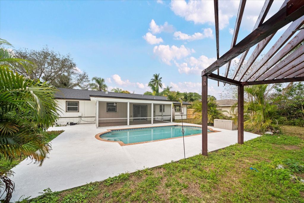 Photo of 1441 SE Sandia Drive, Port Saint Lucie, FL 34984 (MLS # R10958204)