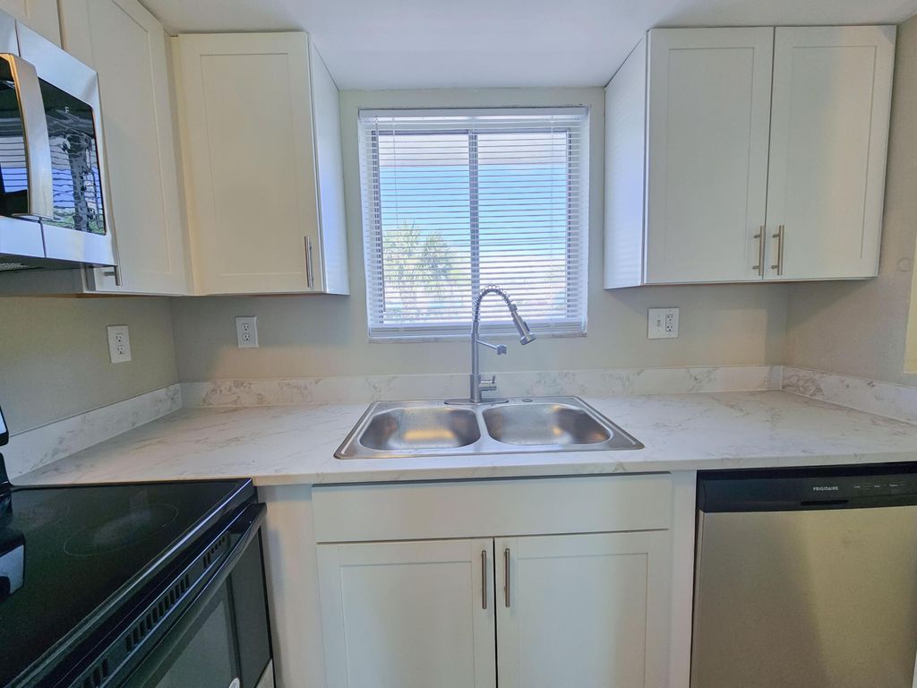 Photo of 1501 Crescent Circle #E40, Lake Park, FL 33403 (MLS # B26008665)