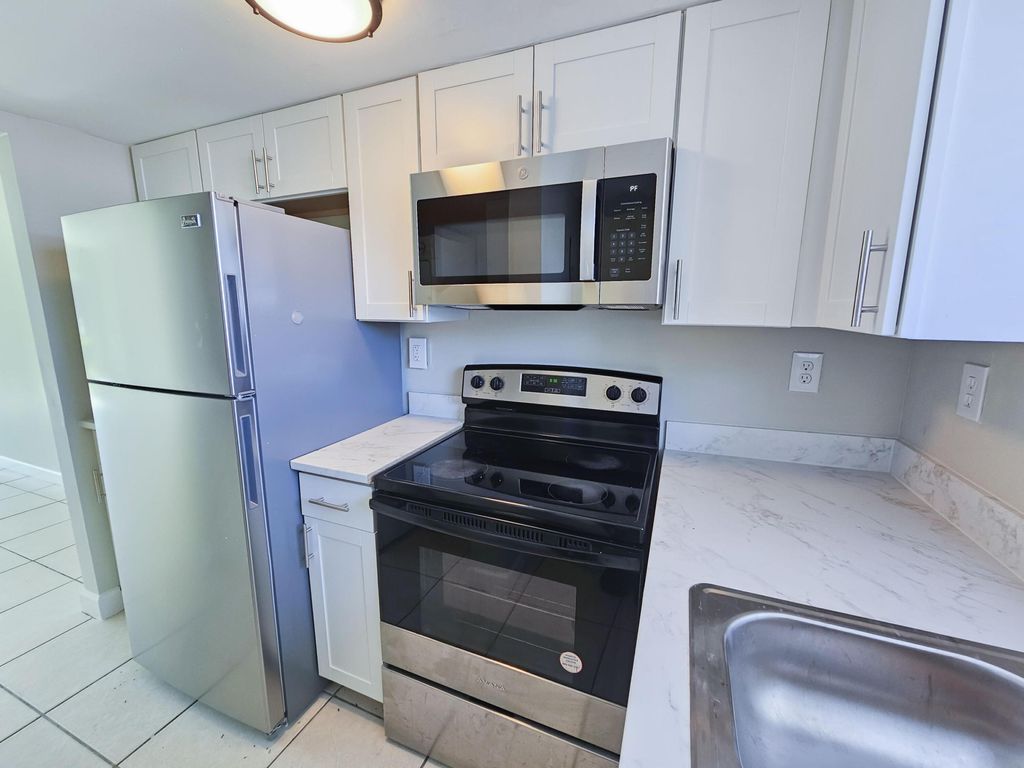 Photo of 1501 Crescent Circle #E40, Lake Park, FL 33403 (MLS # B26008665)
