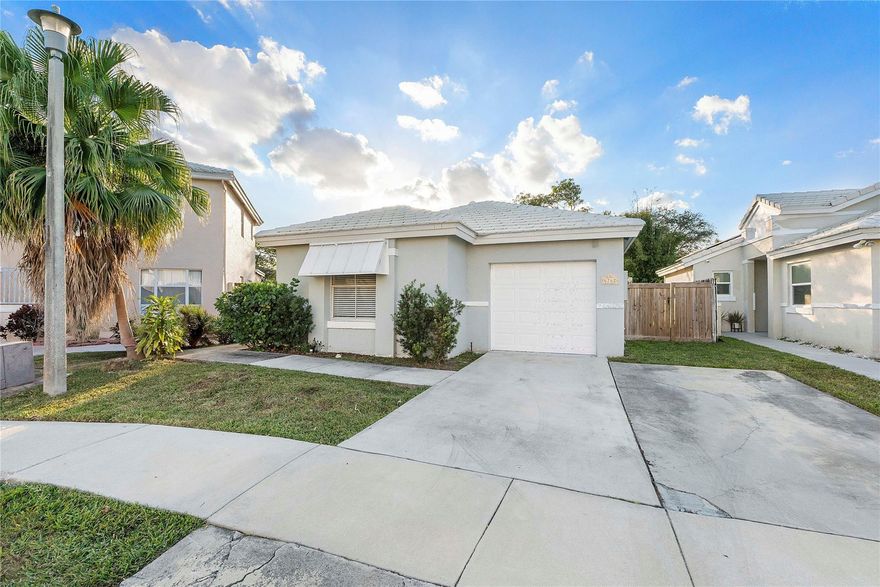 3/2 with 1 car garage and extended driveway.  Totally remodeled with new roof and new appliances.  Move in ready with very low HOA.  Beautiful pools, playgrounds, basketball courts, and clubhouse in this community.