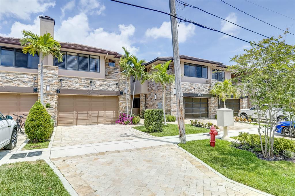 Beautifully designed waterfront townhouse located in the most desirable area of Fort Lauderdale, Coral Ridge. Perfect setting on an extra wide canal with Amazing views of Birch State Park located at the end of the canal. Room for your 42' boat! Also includes boat lift! Full service private dock! Three bedrooms, 2.5 baths ,pool, chef's style kitchen including induction cooktop, wine cooler, french door refrigerator, 2 new A/C units with transferrable warrantee, Impact glass, toto toilets, new neutral carpet make this the perfect home! Amazing water views with patio from your master bedroom! Built-in office and murphy bed in your 2nd bedroom! Two car garage and enough driveway to park up to 6 cars! Tesla charger in garage! Available immediately! This is a BUY!