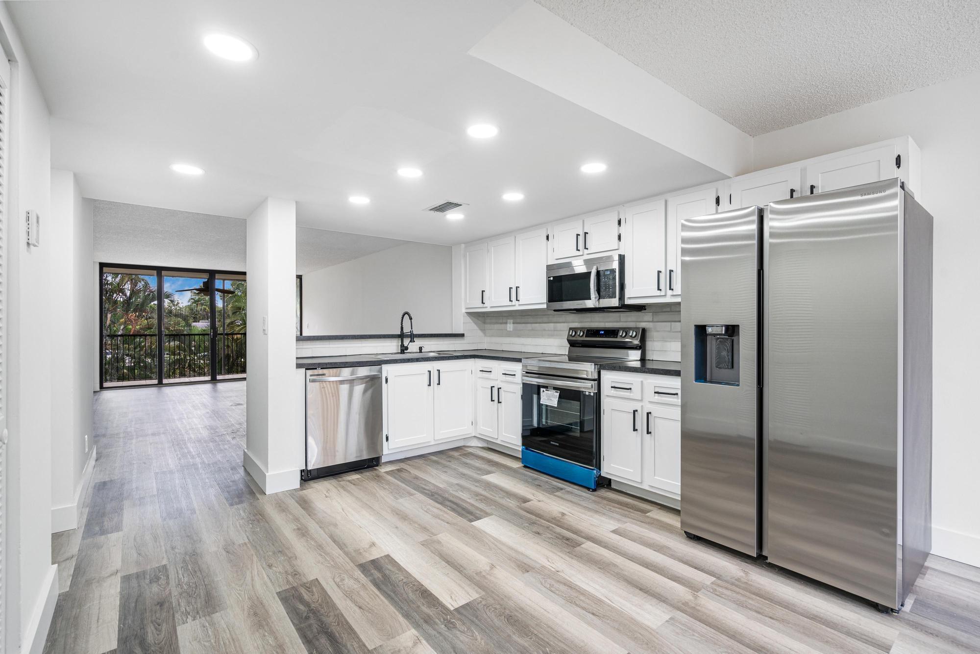 Location! Location! Location! Close to NOVA University highways, beaches and airports. Discover the epitome of modern comfort and convenience with this fully renovated 2-bedroom, 2-bathroom condominium located in the vibrant heart of Davie, Florida. Upon entering, be greeted by glistening new floors leading you through to a stunning kitchen equipped with sleek stainless steel appliances, ready to inspire your culinary creations. Updated bathrooms and in-unit washer and dryer elevates the everyday living experience. Sunlight pours generously into the living room, creating a bright and airy atmosphere for relaxation and entertainment.This exclusive address offers a parking space, guest parking, pool, clubhouse, tennis, and easy access to major highways, shopping, and schools.
