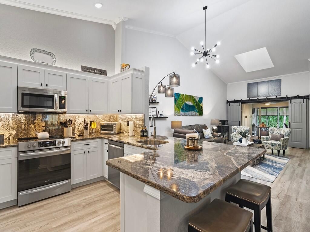 Photo of 3870 SW Whispering Sound Drive, Palm City, FL 34990 (MLS # R10947421)