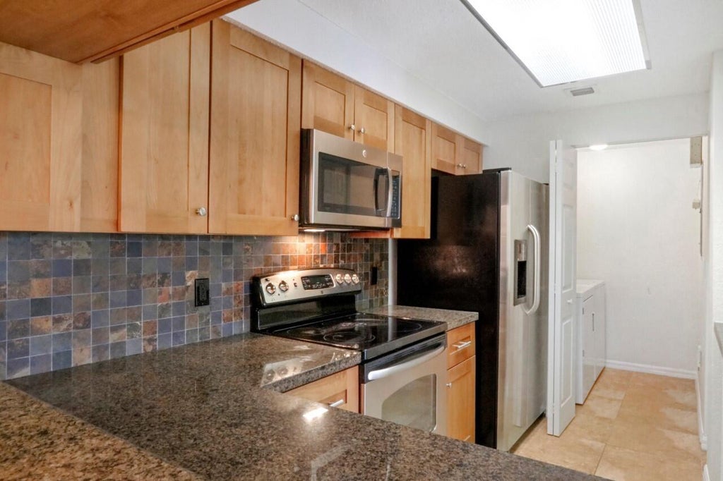 Photo of 3022 Alcazar Place #302, Palm Beach Gardens, FL 33410 (MLS # R11087023)