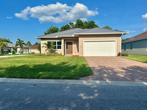 Photo of 660 NE Moss Rose Place, Port Saint Lucie, FL 34983 (MLS # R11093645)