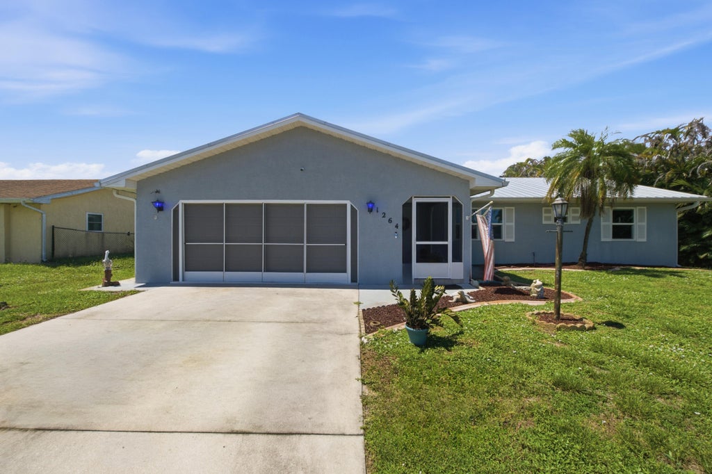 Photo of 1264 SE LADNER Street, Port Saint Lucie, FL 34983 (MLS # B26075429)