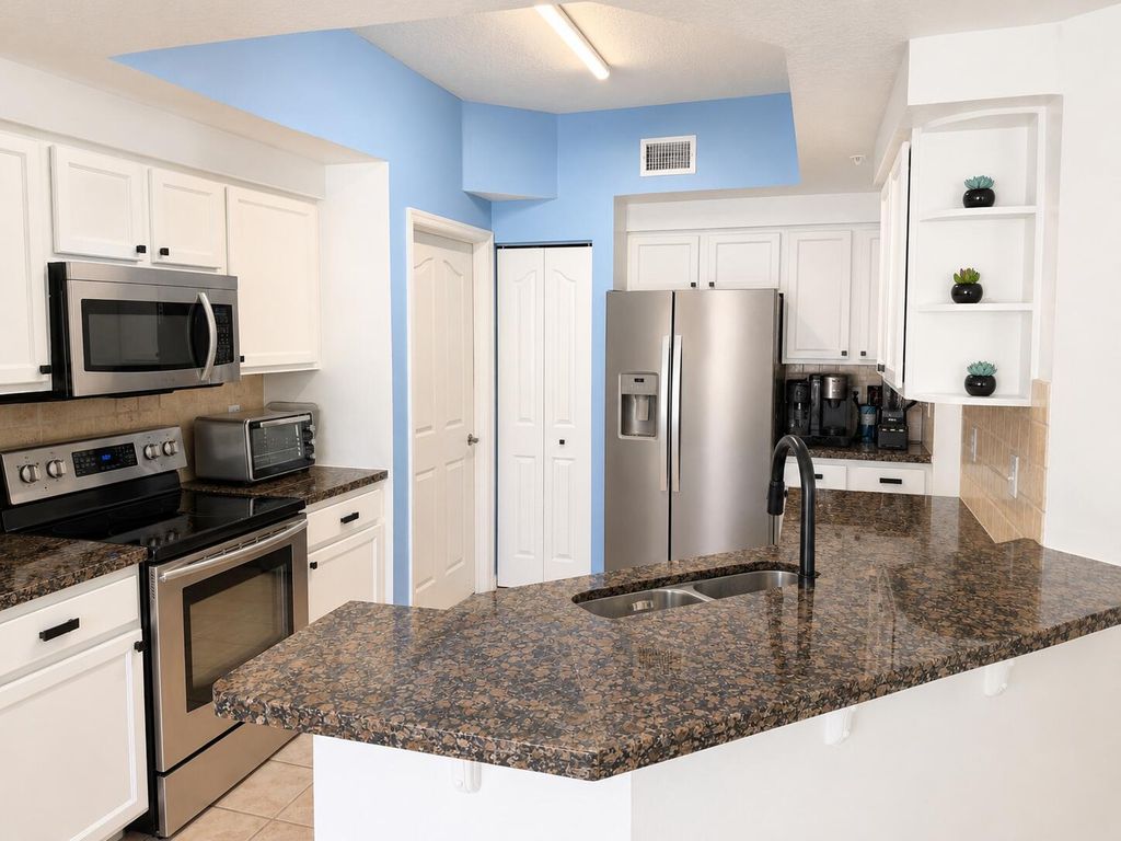 Photo of 224 Murcia Drive #211, Jupiter, FL 33458 (MLS # B26031746)