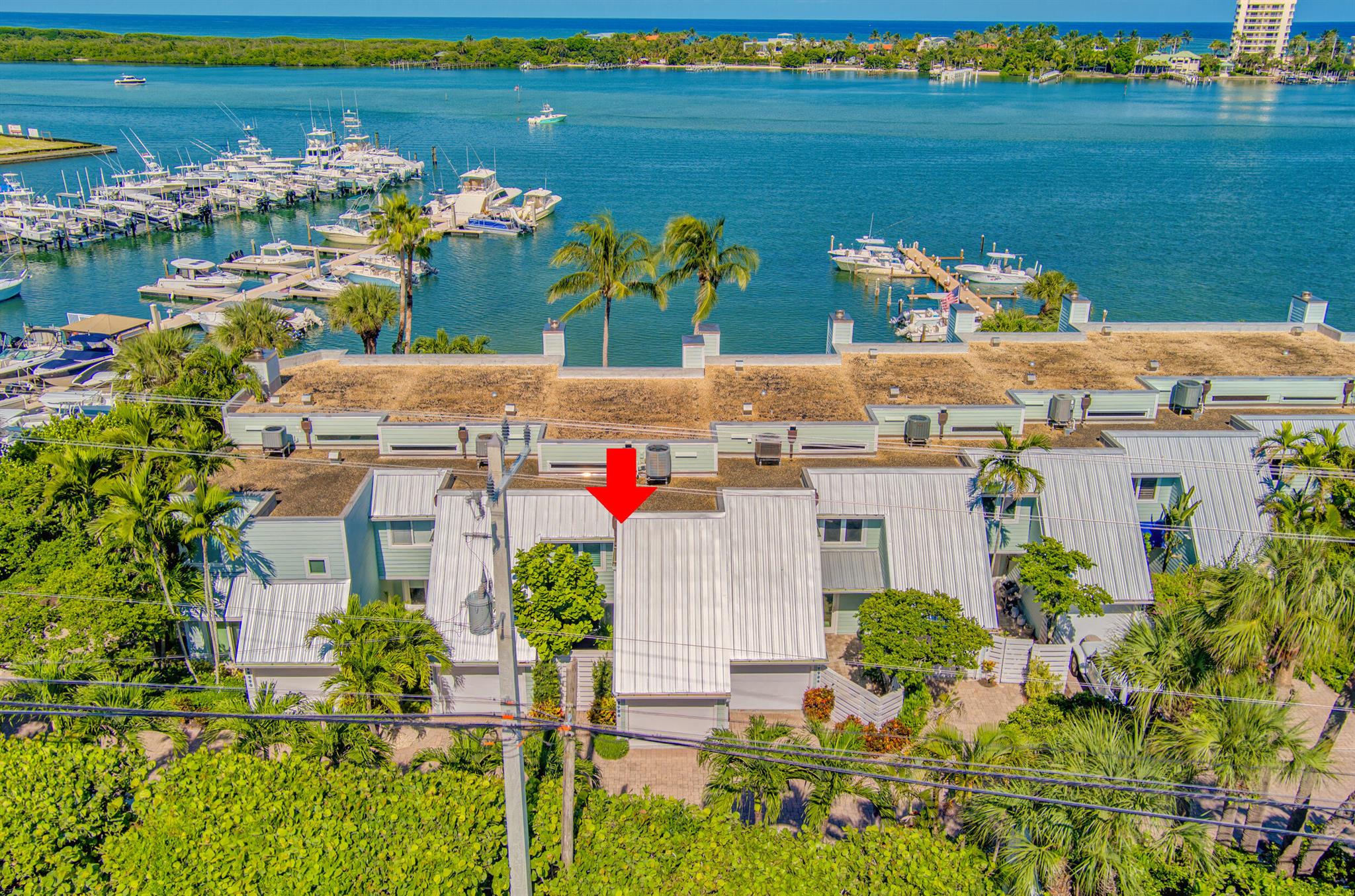 ULTRA RARE waterfront residence available for rental immediately in Scrimshaw Bay! Enjoy your private beach oasis from this luxurious townhome nestled directly on the intracoastal overlooking Tequesta Sandbar! Masterfully designed and flawlessly maintained, this TURNKEY 2 bedroom, 2.5 bath, 1 car garage townhome is your perfect waterfront getaway! Hang up your private hammock, enjot the South Florida sunshine, and create long lasting memories from this incredible resort style home! Fully furnished and decorated to perfection, this inviting 2-story residence is adorned with beautiful oak floors, crown molding, Plantation shutters, custom wall coverings, stunning gourmet kitchen with Butcher Block counter tops, built-in Jenn-air appliances, single bowl sink, and spectacular custom lighting